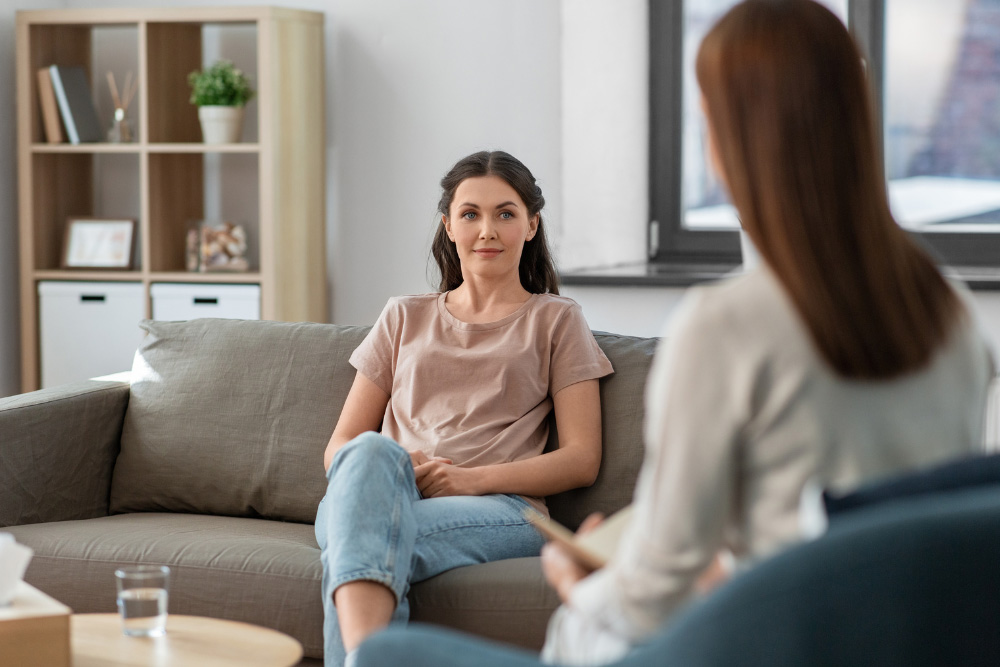 A woman discussing medication management with her psychiatrist.