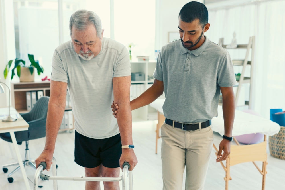 An elderly man working with a physical therapist on balance and gait training therapy near West Norriton, Pennsylvania.