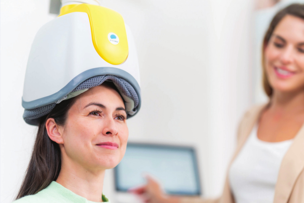 Close up view of a female patient participating in Lansdale TMS therapy for obsessive-compulsive disorder.